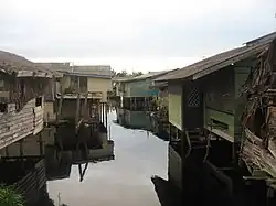 Stilt houses in Matu during a flood