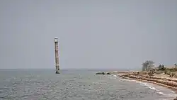 Kiipsaare Lighthouse seen from South with the tip of Kiipsaare Nukk visible in the background, 2023