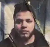 Headshot of Abrego Garcia on a gray background