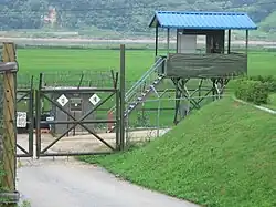 South Korean sentry post with a patrolling soldier seen from south in Korean Demilitarized Zone