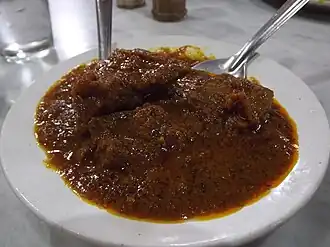 Kosha Mangsho, a spicy and popular Bengali gravy dish made with mutton (goat meat).