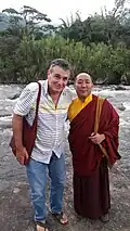Tibetan lama alongside local practitioner in the Orosi River