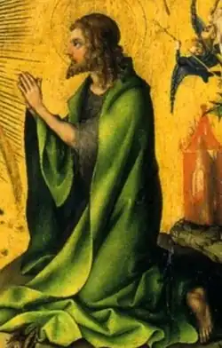 St John kneels in prayer