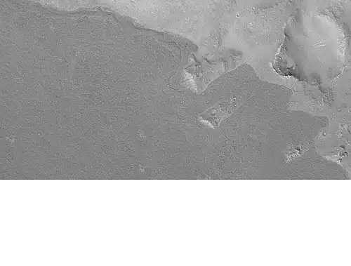 Lava flow in Elysium. There are many lava flows in the Elysium quadrangle. In this one, the lava flowed toward the upper right. Image taken by Mars Global Surveyor, under the MOC Public Targeting Program.