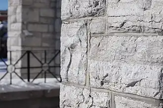 White limestone façade on Southern face of building.