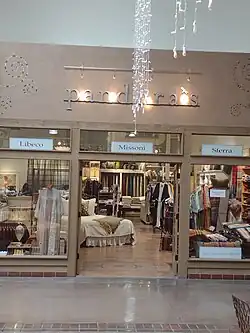 The entrance of a linen store in a shopping mall