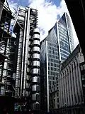 The Lloyd's building is flanked by the Willis Building, as viewed from Lime Street (July 2007)