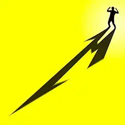 A man with a giant M shadow against a bright yellow background