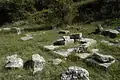 View SE at the remains of the altars south of the Stoa