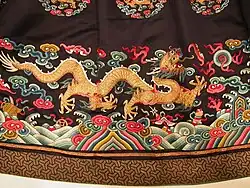 Travelling dragon (xinglong) chasing after a flaming pearl