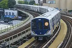 A "B" train composed of R211s, seen in Brooklyn