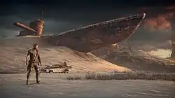 Screenshot of Max, the Magnum Opus and a large ship half-buried in sand