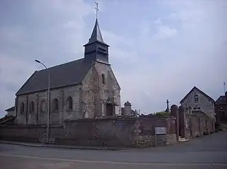The town hall and church in Erquinvillers