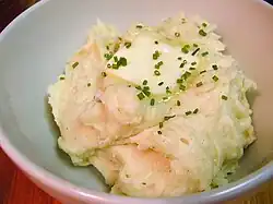 Close-up view of mashed potatoes with butter and chives
