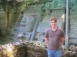 5&nbsp;ft 8 in tall person in front of Mask Temple wall, for perspective.