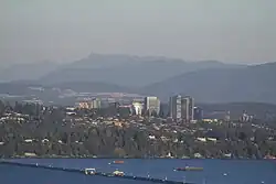 Medina, pictured front just after the Evergreen Point Floating Bridge, with the Bellevue skyline behind