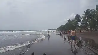 Image 9Limbe Beach with people engaging in various activities (from Tourism in Cameroon)