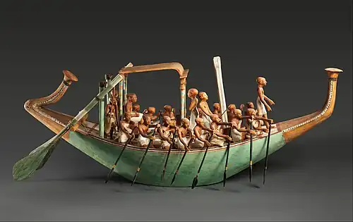 Model paddling boat, c. 1981 – c. 1975 BC, wood, paint, plaster, linen twine and linen fabric, Metropolitan Museum of Art, New York City