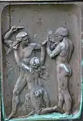 Relief (right) on the socket of the sculpture in Vänersborg