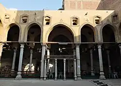 The courtyard of the mosque (looking towards the mihrab). Carved stucco is visible around the arches.