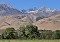 The view from Big Pine. Mount Jepson and Mount Sill centered in the distance with snow lingering below the summits.