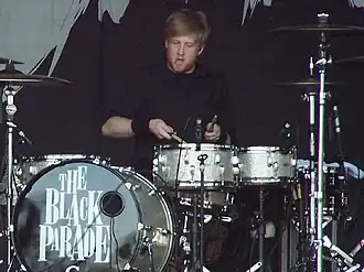 Bob Bryar, a young white man with light hair, playing drums.