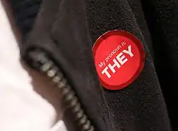 A pronoun sticker that reads "My pronoun is they"