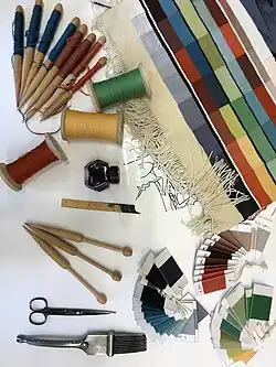 Tapestry bobbins, empty and full