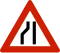 Road narrows On left side.