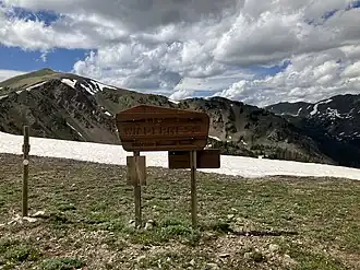 {Never Summer Wilderness sign above Bowen Lake in Arapaho National Forest, CO.}