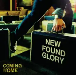 A photo of a person walking out of a restaurant holding a suitcase that reads "New Found Glory". The album title "Coming Home" appear in the bottom-left of the image.