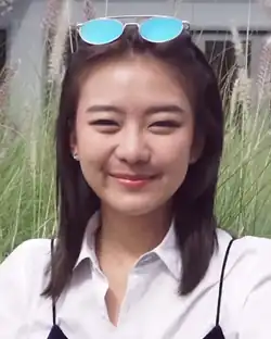 Chatchaipholrat from Game of Teens 2017, smiling with glasses in rest