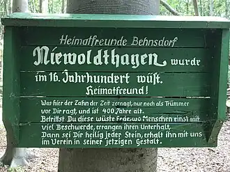 Plaque in front of the church ruins