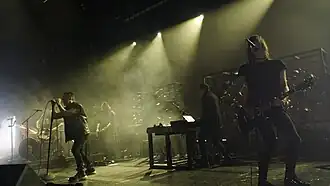 Nine Inch Nails performing in 2022; (L–R): Ilan Rubin, Trent Reznor, Alessandro Cortini, Atticus Ross, Robin Finck