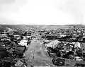 Nogales International Boundary looking west, in 1899 (prior to boundary fence and border inspection facilities)