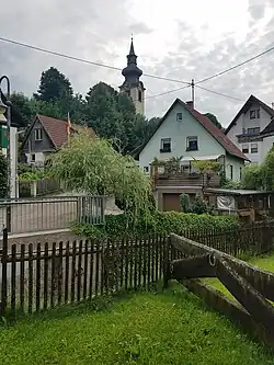 The village center of the town of Obereschach, with the tower of the Church of St. Ulrich in the background