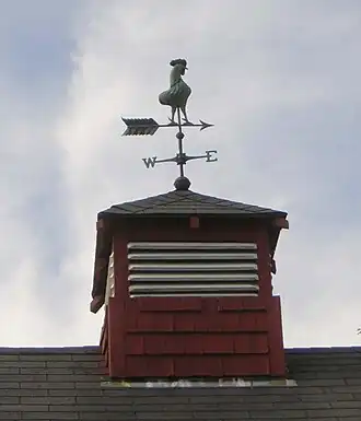 Weathervane. The cock's tail is in the barn.
