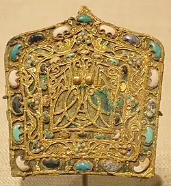Eastern Jin dynasty cicada-patterned dāng (珰) plaque ornament, with embedded gemstones.