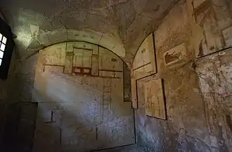 Room 5 of the House of the Painted Vaults. A wall painting of an erotic scene is on the south wall. 250 CE