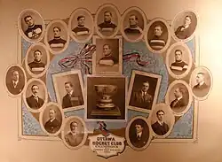 A postcard that has small profile photos of members of an ice hockey team, with a trophy in the middle of the card and a caption below it