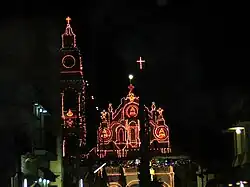 The basilica after dark decorated with lights on the feast day