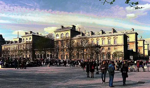 The Hotel-Dieu de Paris, the oldest hospital in Paris, next to the Cathedral of Notre Dame on the Île de la Cité, was enlarged and rebuilt by Haussmann beginning in 1864, and finished in 1876. It replaced several of the narrow, winding streets of the old medieval city.