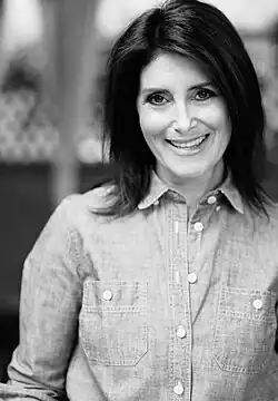 A black and white headshot of Fryman