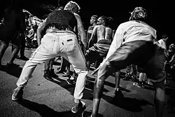 Black and white photo of two people twerking