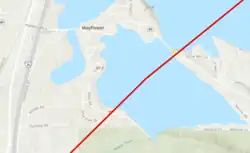 A red line going through a town and over a lake.