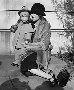 Alice Roosevelt Longworth on her 43rd birthday in 1927 with daughter Paulina, age 2