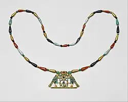 Pectoral and necklace of Princess Sithathoriunet; circa 1887–1813 BC; gold, carnelian, lapis lazuli, turquoise, garnet & feldspar; height of the pectoral: 4.5 cm (13⁄4 in.); The Met
