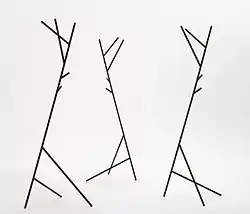 A coat stand looking different from every viewing angle inspired by tree branches, designed by Busk-Hertzog in 2012.