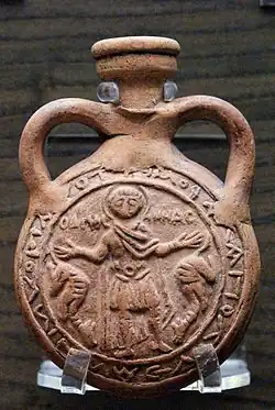Terracotta pilgrim's Menas flask impressed with Saint Minas between two camels, Byzantine, 6th–7th century, probably made at Abu Mina, Egypt