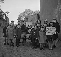 Welsh children with their Guy Fawkes effigy in November 1962. The sign reads "Penny for the Guy".